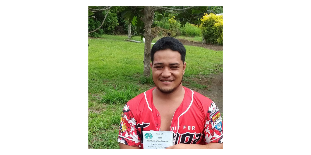 student holding cash gift